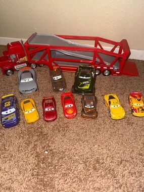 Disney Red Car Carrier Truck with Assorted Colorful Race Cars